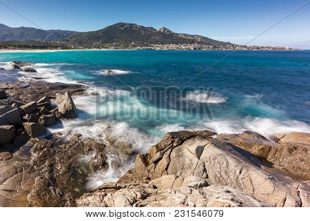 Waves Washing Onto Rocks Near Algajola Beach In Corsica