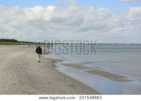 Walking On The Beach At Marielyst On The Island Falster. Denmark