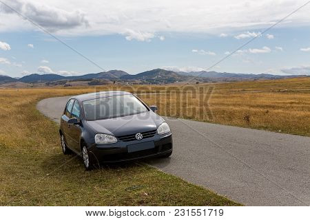 Zabljak, Montenegro - September 19: Car With The Traveler Stands On The Roadside In A Yellow Field I