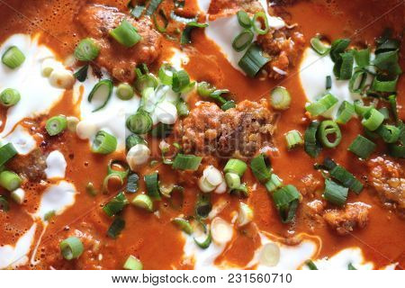 Indian Meal: Minced Meat With Red Lenses In Tomato-coconutmilk-sauce, Decorated With Yogurt And Spri