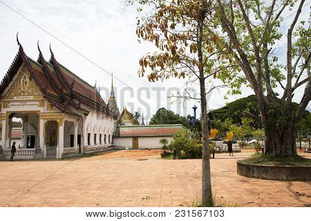 Three Buddha Brother Statue Beside Ubosot And Chedi Of Wat Phra Borommathat Chaiya Temple In Chaiya 