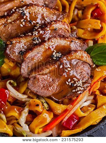 Fried Dack Meat With Egg Noodles Closeup