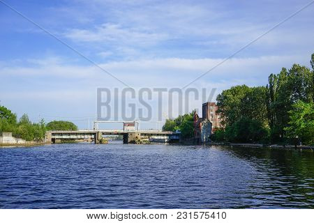 Kaliningrad, Russia - May 11, 2016: . The Pregolya River And The Ancient Bridge With The Pilot House