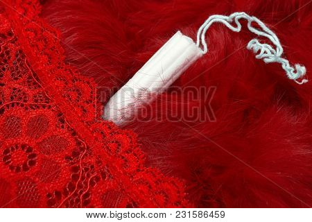 Red Fur, Red Pants And A Menstrual Tampon. Vaginal Products For Intimate Care. Woman Critical Days, 