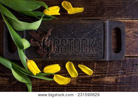 Stylish Wooden Board And Flower Petals And Chocolad- Frame Under Your Text.
