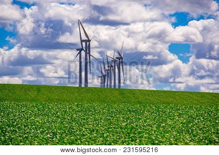 Wind Powered Electricity Generators Sitting At The Top Of A Hill. Located In Eastern Oregon.