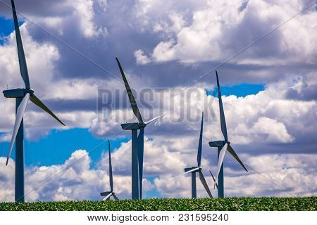 Wind Powered Electricity Generators Sitting At The Top Of A Hill. Located In Eastern Oregon.