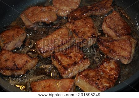 Lever And Onions In A Frying Pan Roasted With Herbs And Spices