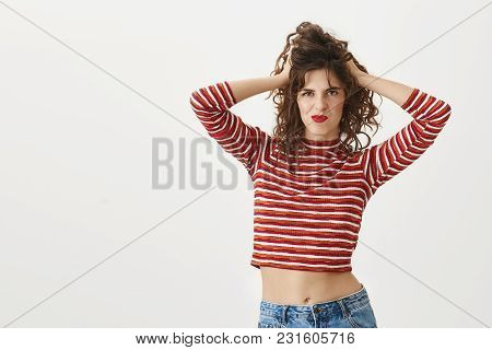 Looking Sassy Today. Portrait Of Confident Sexy Woman Touching Hair And Messing It, Grimacing While 
