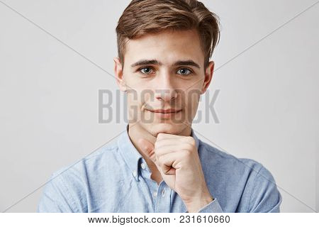 Close Up Portrait Of Attractive Young Guy. Please, Talk, I Am Listening. Handsome Young Man Hears Pr
