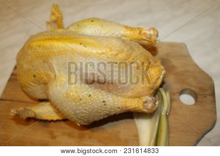 Homemade Stuffed Capon On Wooden Cutting Board