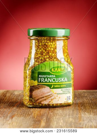 Kwidzyn, Poland - March 17, 2018: Kamis Mustard On Gradient Background. Kamis Was Founded In Poland 