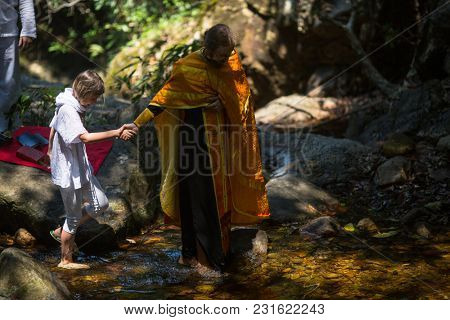 KOH CHANG, THAILAND - MAR 10, 2018: During Christian sacrament of spiritual birth - Baptism. There are currently 10 Orthodox parishes in Thailand, Orthodoxy is practiced by 0.002% of population.