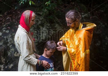 KOH CHANG, THAILAND - MAR 9, 2018: During Christian sacrament of spiritual birth - Baptism. There are currently 10 Orthodox parishes in Thailand, Orthodoxy is practiced by 0.002% of population.