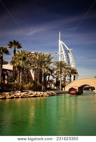 DUBAI, UAE - FEBRUARY, 2018: View on Burj Al Arab, the world only seven stars hotel seen from Madinat Jumeirah, a luxury resort which include hotels and souk spreding across over 40 hectars.