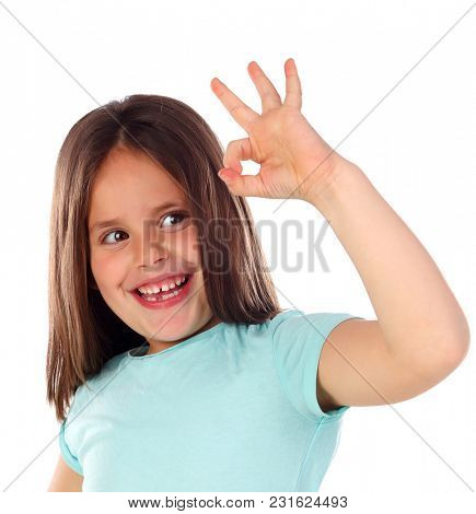 Friendly child saying Ok with her hand isolated on a white background