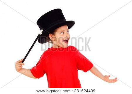 Pretty little girl doing magic with a top hat and a magic wand isolated on a white background