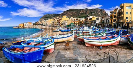 Traditional fishing village Aspra with colorful boats in Sicily. Italy