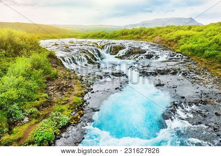 Bruarfoss Waterfall With Blue Water In Iceland. Beautiful Summer Landscape