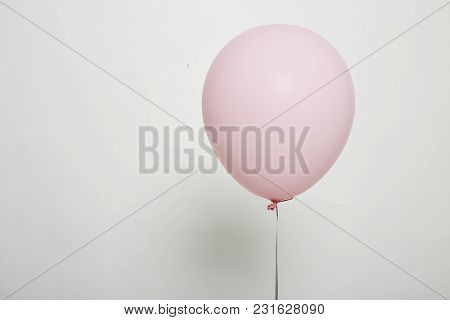 White Balloon Floating On White