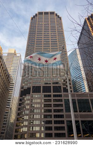 Chicago City Flag Flying Majestically In City Skyline Scene