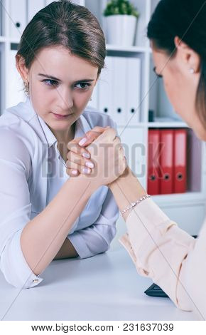 Two Female Office Wokers Armwrestling, Exerting Pressure On Each Other, Struggling For Leadership. B