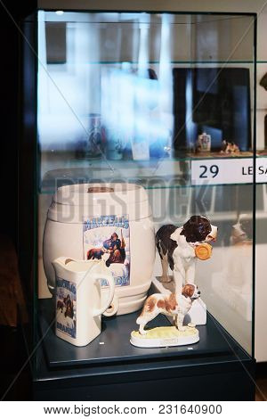 Martigny, Switzerland -  January 1, 2015: Handmade Bottle And Statue With Saint Bernard Dog In Breed