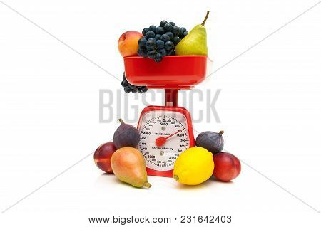 Kitchen Scale And Fruit Isolated On White Background. Horizontal Photo.