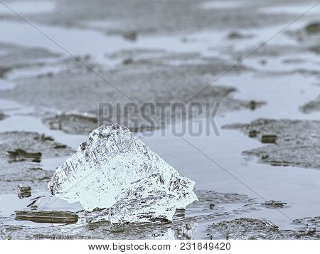 Winter Coastal Under Icy Cover. Icy Andscape With Broken Pieces Of Blue  Ice. Colorful Toned Photo W