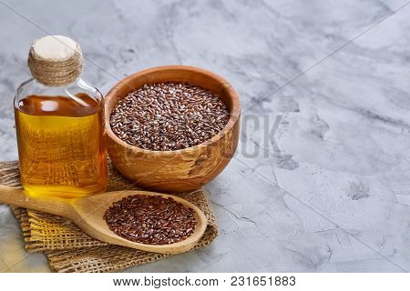 Selective Focus Close-up Picture Of Uncooked Healthy Nutritious Flax Seed On White Textured Backgrou