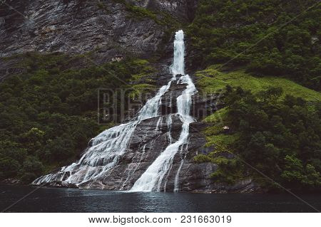 Bottle Shaped Waterfall In Norway Fjord Geiranger