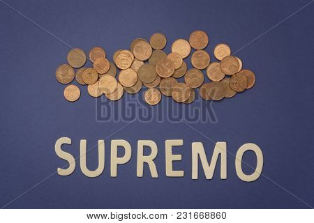 Supremo Written With Wooden Letters On A Blue Background To Mean A Business Concept