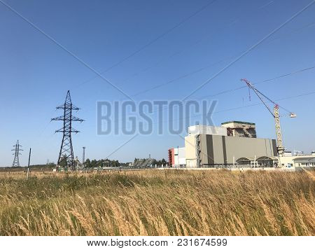 Nuclear Power Plant Located In The Town Of Desnogorsk. In The Background Of The Station Building, Cr
