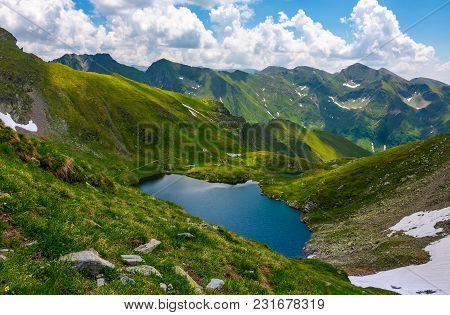 Beautiful Landscape In Fagarasan Mountains. Popular Travel Destination. Capra Lake Between Hills, Mo