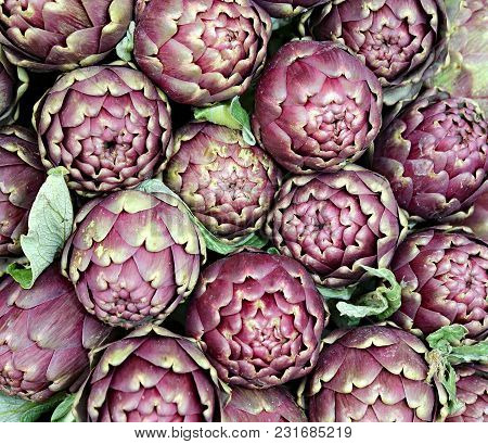 Background Of Many Artichokes For Sale In The Fruit And Vegetable Market