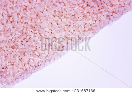 Pink Rice On A White Background, Texture And Background.