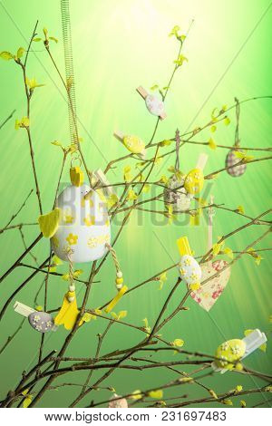 Composition Of Branches With Young Leaves And Green Buds, Decorated For Easter With Easter Eggs, Hea