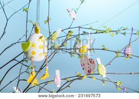 Composition Of Branches With Young Leaves And Green Buds, Decorated For Easter With Easter Eggs, Hea