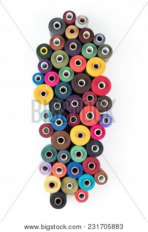Set of coloured thread coils on white background, sewing and tailoring