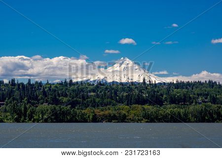Mt Hood As Seen From The North. Trees And Columbia River Below.