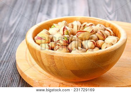 Dish Full Of Pistachios With More Pistachios On Side