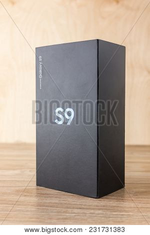 March 2018. Samsung Galaxy S9 In The Box Close-up. A New Smartphone Sealed In A Box On A Wooden Tabl