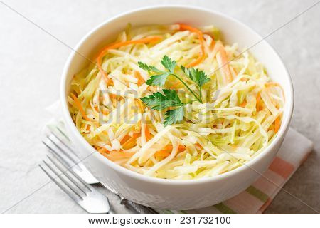 Fresh Coleslaw Salad In Bowl On Gray Stone Background.