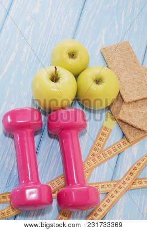 The Concept Of A Healthy Diet. Small Dumbbells, Apples. Healthy Lifestyle. Sport Fitness Food