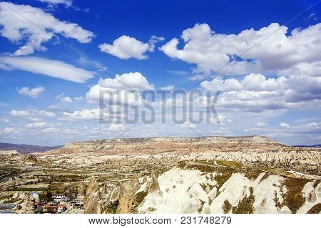 Top View On Mountain Valley In Clear Sunny Day With Beautiful Clouds. Turkey, Cappadokia.