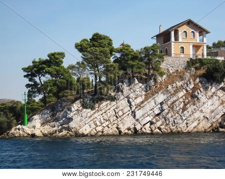 Pink House On The Top Of The Cliff In Croatia
