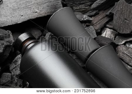 Original Black Matte Bottle Of Vodka Or Tequila And Black Shot Glass .on Charcoal Background. Black