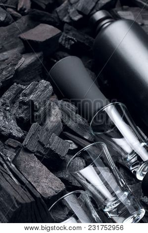 Black Set Of Matte Bottle Of Alcohol And Shot Glasses. On Charcoal Background. Black Edition.creativ