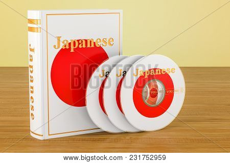 Japanese Language Textbook With Flag Of Japan And Cd Discs On The Wooden Table. 3d Rendering