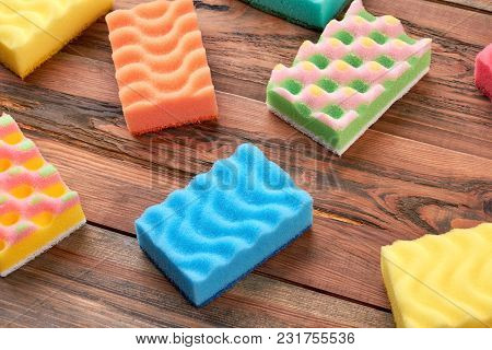 Housekeeping Sponges On Wooden Background. Set Of Colorful Kitchen Sponges On Wooden Table. House Cl